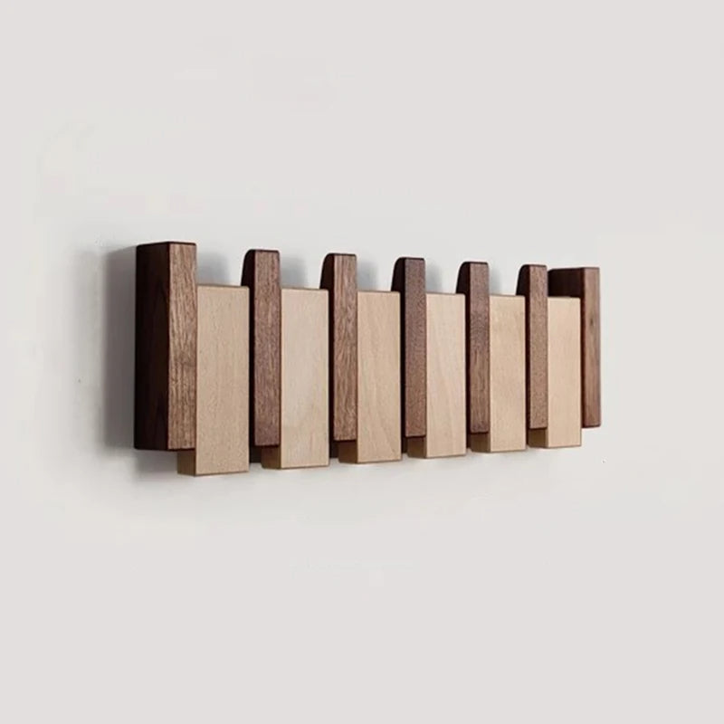 Garderobenleiste im Klavier-Design mit klappbaren Haken