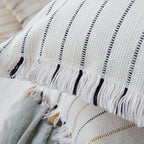 Decorative cotton cushion cover with striped tufted appearance and fringes