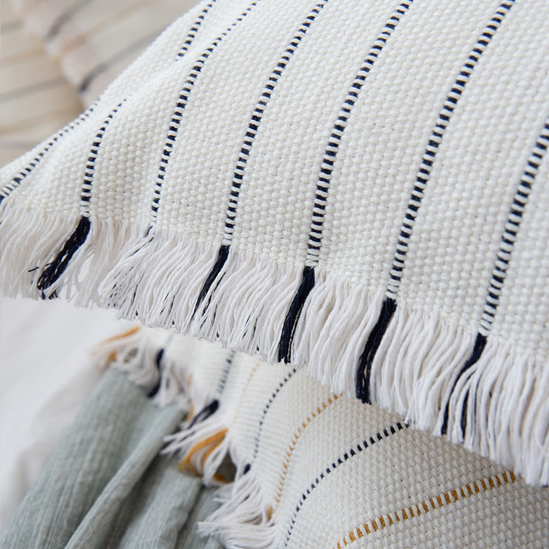 Decorative cotton cushion cover with striped tufted appearance and fringes