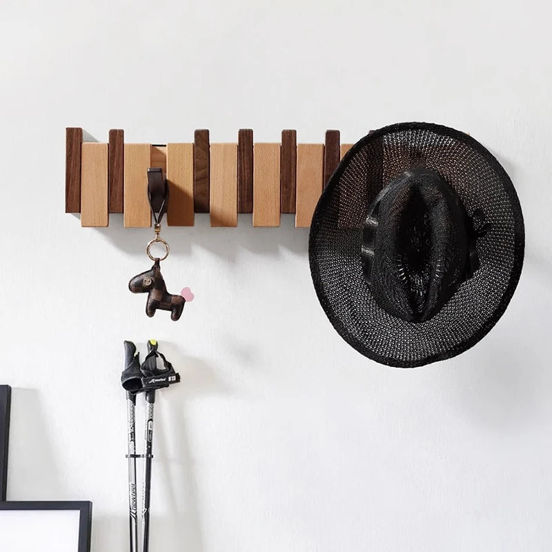 Garderobenleiste im Klavier-Design mit klappbaren Haken