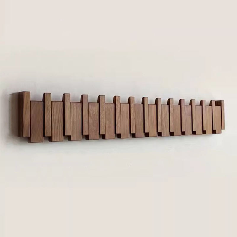 Garderobenleiste im Klavier-Design mit klappbaren Haken