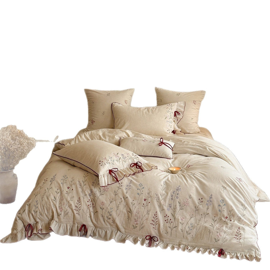 Luxurious linen bedding set with hand-embroidered bamboo and bird motif