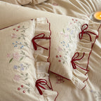 Luxurious linen bedding set with hand-embroidered bamboo and bird motif