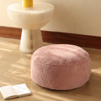 Low leather pouf with plush microfibre cover and shape-retaining foam filling