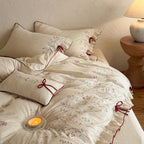 Luxurious linen bedding set with hand-embroidered bamboo and bird motif