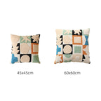 Hand-tufted decorative cushion with abstract graphic design and textured cotton surface