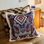 Square decorative cushion with mandala-like jacquard pattern and linen flange