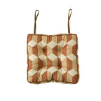 Padded chair cushion with ties and quilted tufted upholstery