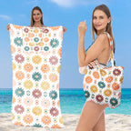 Strandtuch mit eleganten Blumenmustern