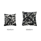 Hand-tufted decorative cushion with abstract graphic design and textured cotton surface