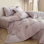 Quilted bedding set with velvet look, quilted heart pattern and lace border