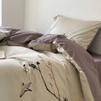 Reversible cotton satin bed set with finely embroidered bird and branch motifs