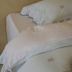 Quilted bedding set made of cotton blend with gingham check and delicate floral embroidery