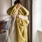 Reversible quilted comforter with structured box stitching and cotton trim