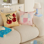 Dekoratives Patchwork-Birnenkissen mit Pompon-Ecken