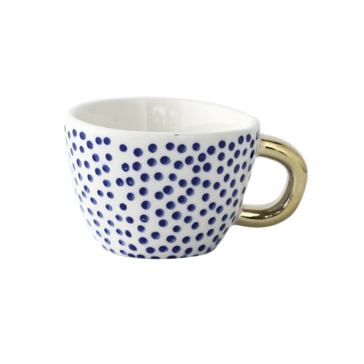 Tasse mit abstraktem geometrischem Muster und Goldhenkel