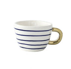 Tasse mit abstraktem geometrischem Muster und Goldhenkel