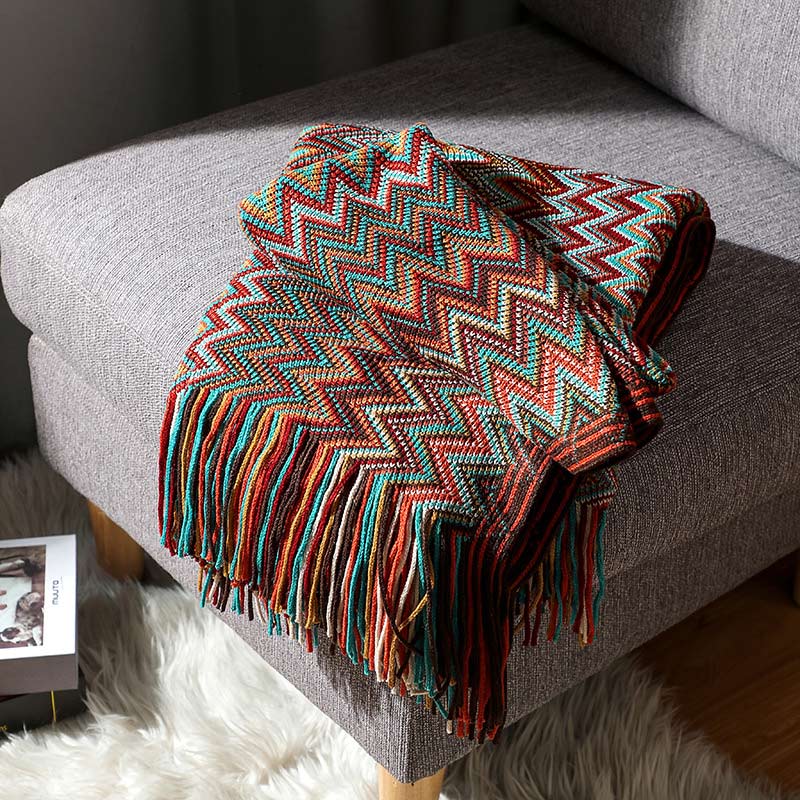 Bunte gestreifte Wohndecke mit Quasten