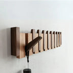 Elegante Garderobenleiste aus Holz im Klavier-Design